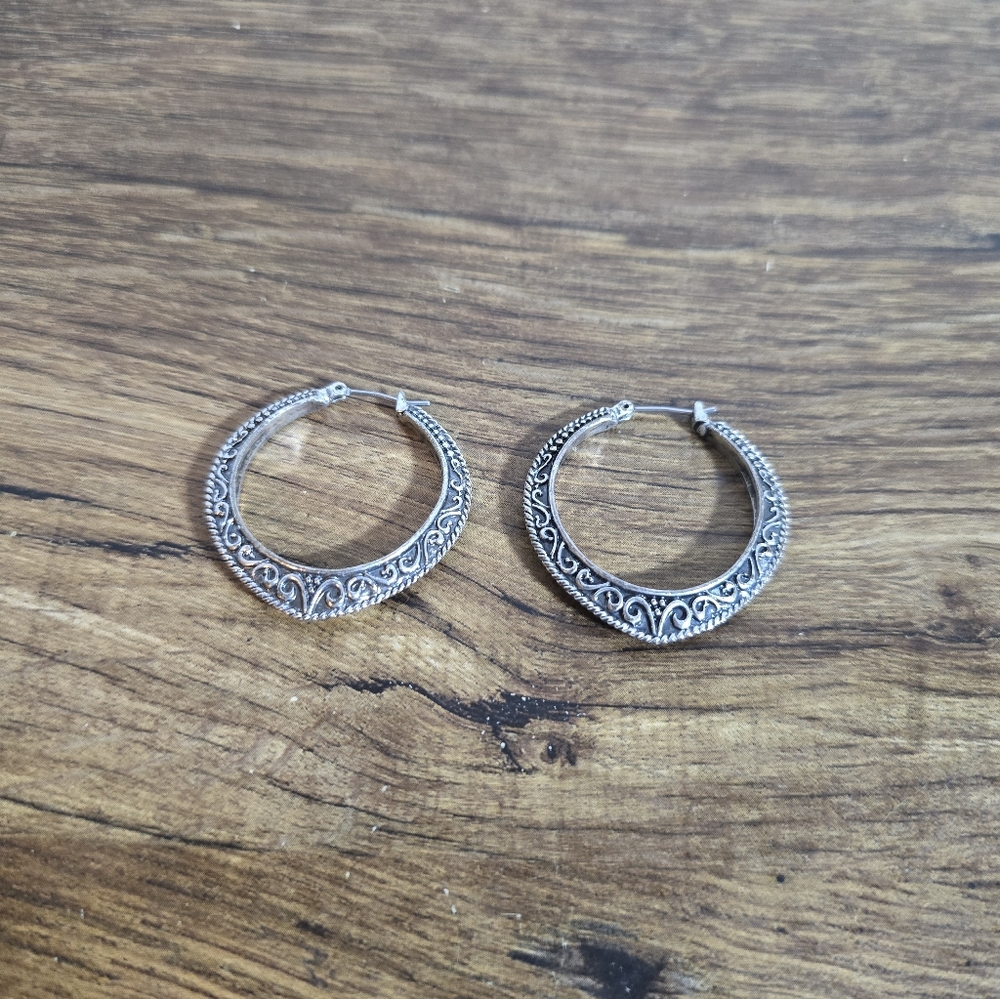 hoop earrings from Bali, featuring ornate details and an oxidized finish